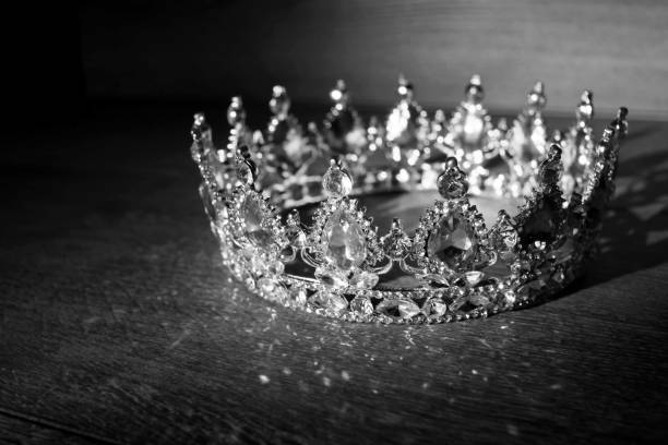 istock Luxury golden crown with red stones. Ruby, garnet. Black and white 1395900127