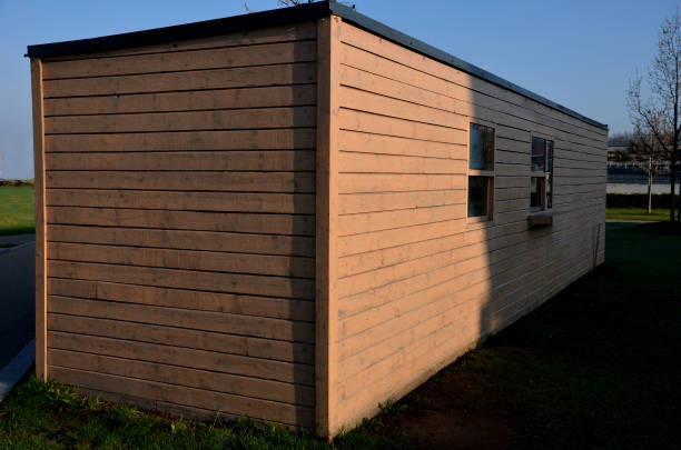 istock residential brown container with window door. modular living anywhere. surgery or testing center. locker room background for athletes or builders on construction site 1395901068