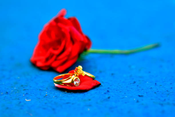 Two roses close-up and wedding ring