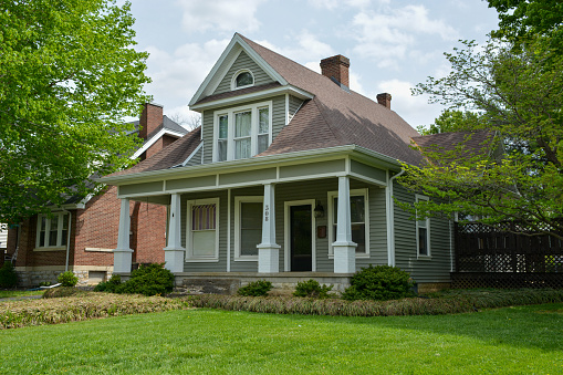 Campbellsville, KY, 2022: A prominent recessed dormer is a key identifying feature of this historic home.