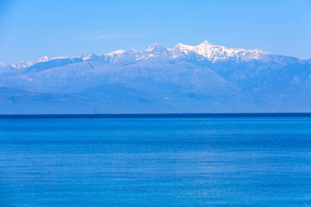 Blue sea view and mountain snow peaks panorama in Messinia, Peloponnese, Greece