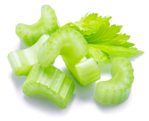 istock Pile of celery ribs and cuts isolated on white background. 1395906671