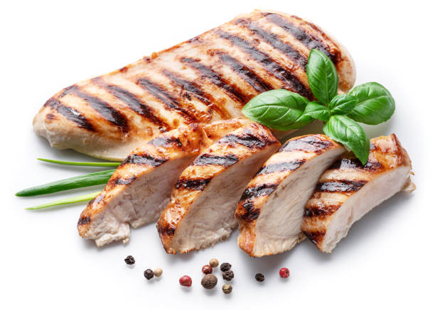 istock Grilled chicken fillet with herbs isolated on white background. 1395906858