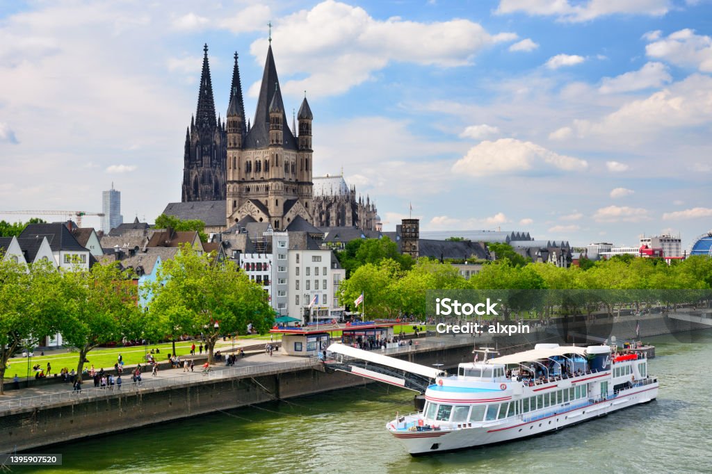Rhine River in Cologne, Germany Promenade and Rhine River in Cologne, Germany. Composite photo Cologne Cathedral Stock Photo