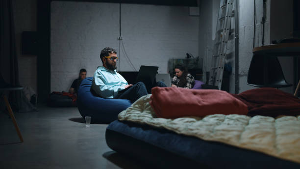 istock Man using laptop in a bomb shelter 1395907707