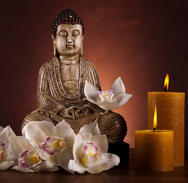 istock Buddha statue with orchid flower 139591490