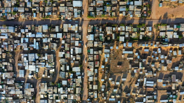 Aerial view of a landscape of an informal settlement in a poor area of South Africa. Township or shantytown, low income housing and poverty