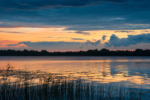 The nature of Belarus, a serene summer morning, a bright dawn on Lake Selyava