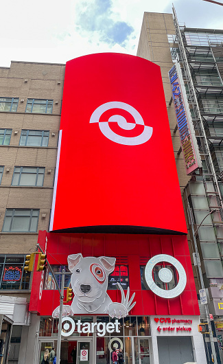 New York, 4-9-2022: Large vertical electronic display shows the Target's logo over the entrance to the store.