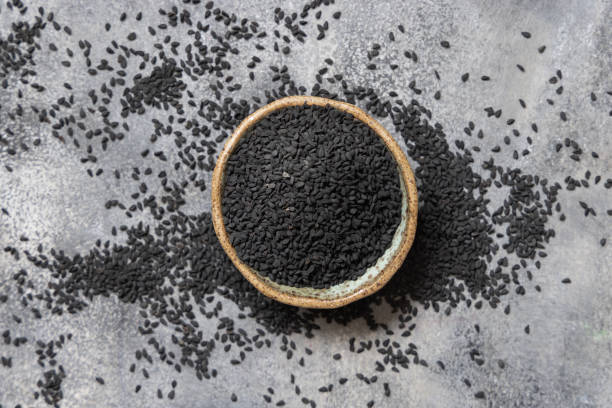 istock Indian spice Black cumin (nigella sativa or kalonji) seeds in bowl top view 1395926729
