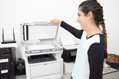 woman using photocopy machine