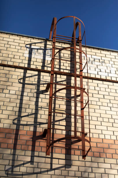 Fire escape on building. Steel forester on house. Details of building.