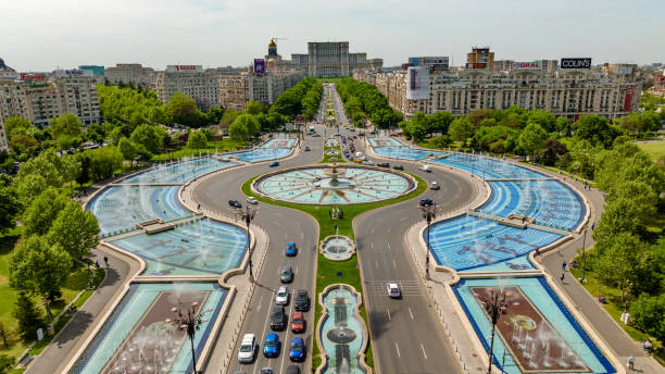 Aerial view of Unirii Square, Bucharest Romania on a sunny day. Mavic 3 4k drone shot of a urban metropolitan area at Bucharest romania stock pictures, royalty-free photos & images