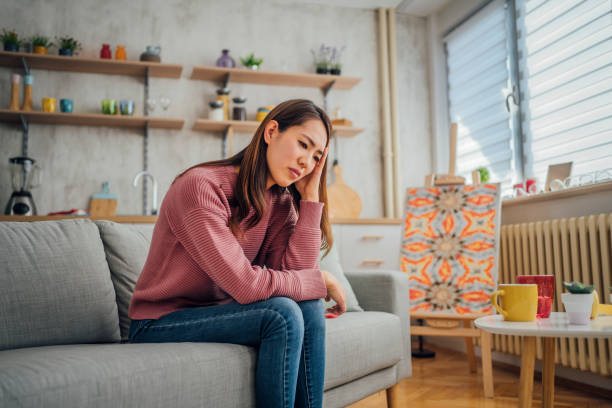istock Upset woman at home 1395937675