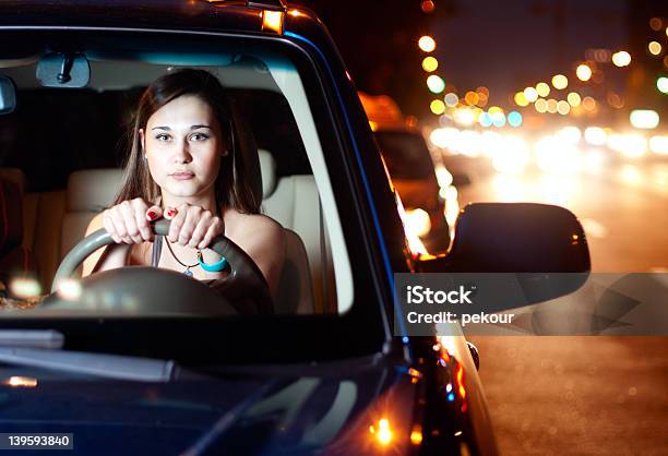 Young Woman Driving Car In The Night City Stock Photo - Download Image Now - Driving, Night, One Woman Only