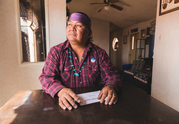 man voting by mail - native american north american tribal culture women mature adult imagens e fotografias de stock