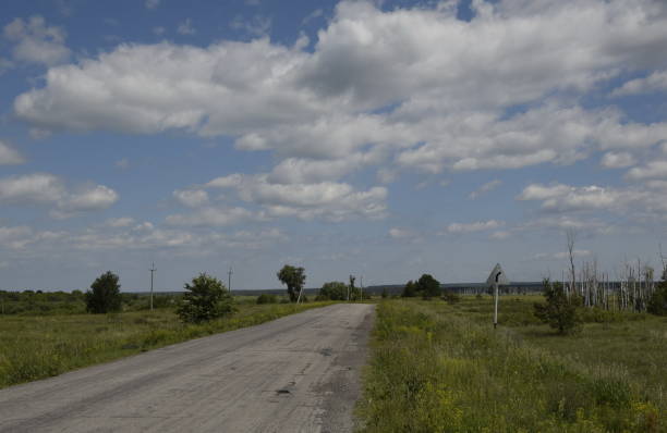 istock Paved country road on a clear summer day 1395940047
