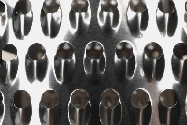 istock Modern metal grater as background, top view 1395940432