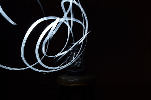 Drawing with light on a photo in the studio.