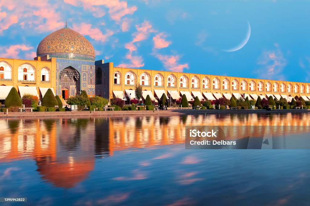 Iran. Persia. Isfahan. Dome of Sheikh Lotfollah Mosque at Naqsh-e Jahan square in Isfahan at sunset. Isfahan Stock Photo