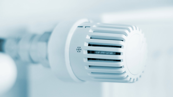 Close-up of the thermostatic valve from the heater - blu toned image