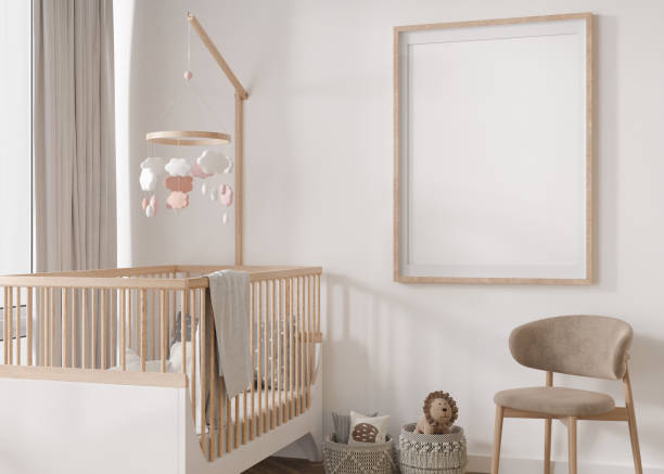 istock Empty vertical picture frame on white wall in modern child room. Mock up interior in scandinavian style. Free, copy space for your picture. Baby bed, chair. Cozy room for kids. 3D rendering. 1395945497