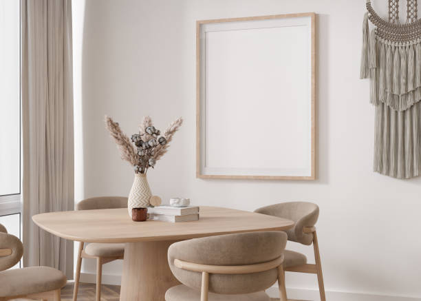 istock Empty vertical picture frame on white wall in modern living room. Mock up interior in scandinavian, boho style. Free, copy space for your picture. Table, macrame, vase, dried grass. 3D rendering. 1395945512