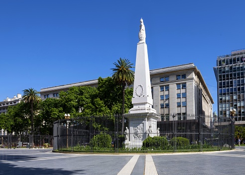 Buenos Aires, Argentina, October 30, 2019: View of the small obelisk Pirámide de Mayo on the Plaza de Mayo. It is the oldest national monument in Buenos Aires.