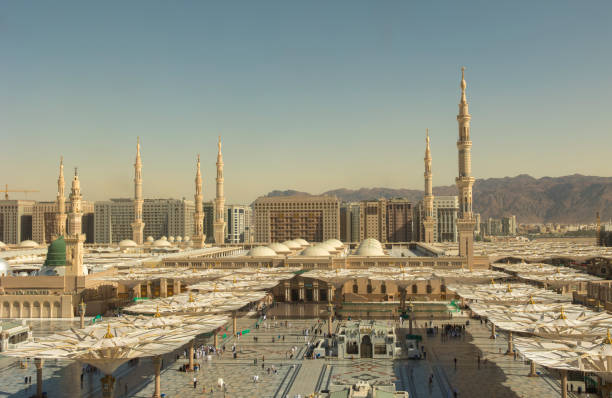 View overlooking the Al Masjid Al Abawi Mosque in Medina, Saudi Arabia. The second holiest site in Islam. Al-Masjid an-Nabawi, known in English as The Prophet's Mosque, is a mosque built by the Islamic prophet Muhammad in the city of Medina in the Al Madinah Province of Saudi Arabia. al masjid an nabawi stock pictures, royalty-free photos & images