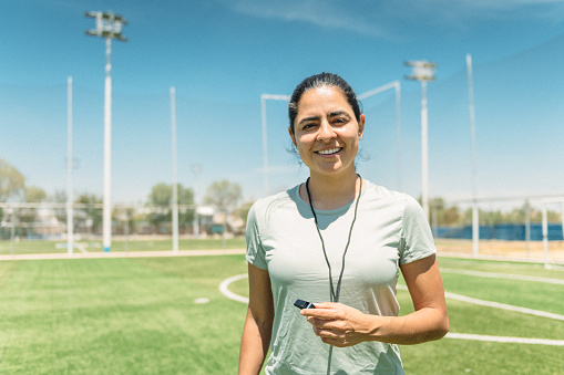 Portrait of female soccer referee on soccer field