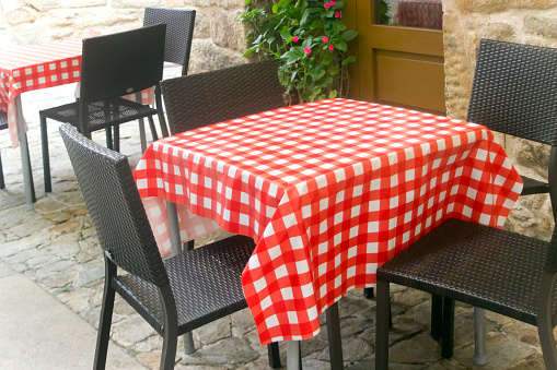 Sidewalk cafe, restaurant. Checkered tablecloth. Galicia, Spain.