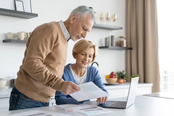 istock Middle aged couple checking finance account together 1395951579