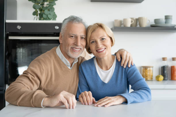 istock Happy elderly married couple looking at camera 1395951645
