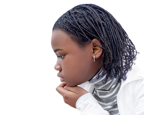 Young Afro beauty (12 years old) with braided hair, pensive expression, side view, isolated (cut out), white background