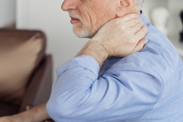istock Mature aged man with neck pain, feeling sick 1395951860