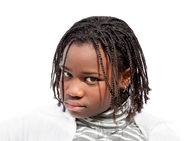 Moody girl with dreadlocks (12 years old), white background, photo Moody girl with dreadlocks (12 years old), white background, photo little black girl hairstyle stock pictures, royalty-free photos & images