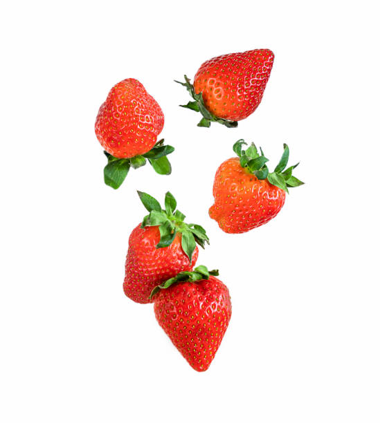 istock Falling ripe strawberry isolated on white background 1395953783