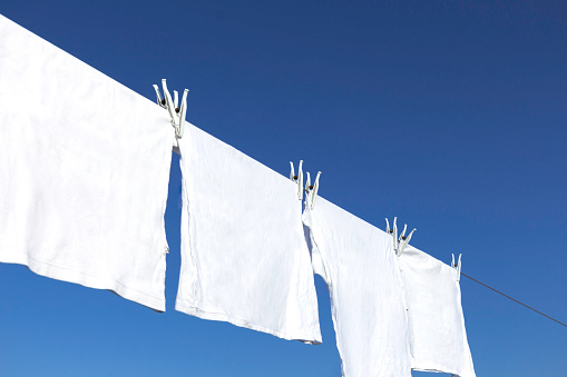 Drying Laundry with blue sky in background
