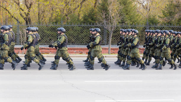 Victory Day Parade rehearsal Krasnoyarsk, Russia - May 5, 2022: Solemn marching of Russian special forces of during rehearsal of the Victory Day Parade man showing peace sign stock pictures, royalty-free photos & images