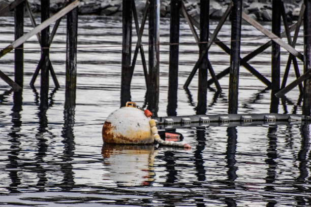 A large metal buoy floating in the waters of Valdez Alaska