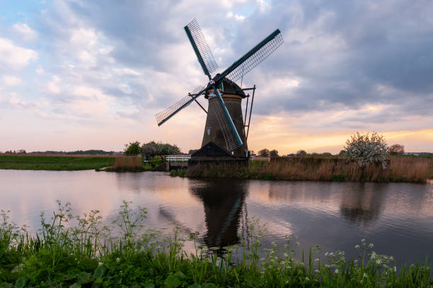 istock Sunset on traditional Dutch windmills, at Kinderdijk 1395967695