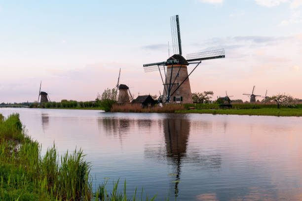istock Sunset on traditional Dutch windmills, at Kinderdijk 1395967711