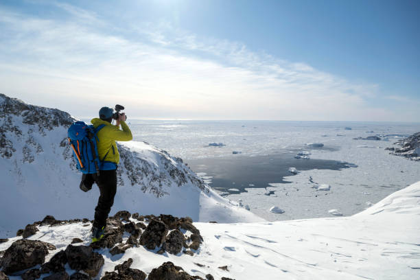 istock Adventure filmmaker on a remote expedition 1395969386