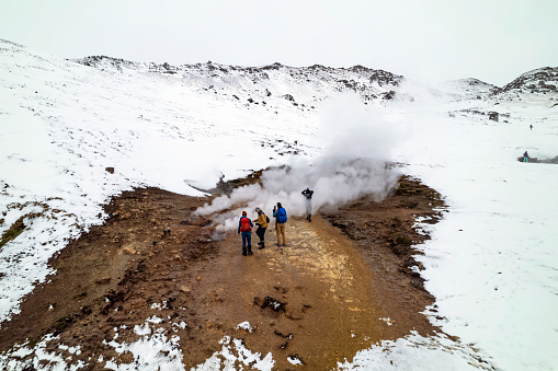 Hiking to Reykjadalur Hot Springs in winter. Free things to do in Iceland. Unique Iceland travel ideas in winter.