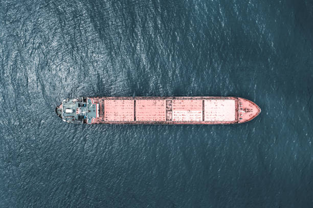 istock Aerial view of cargo ship in transit. 1395972097
