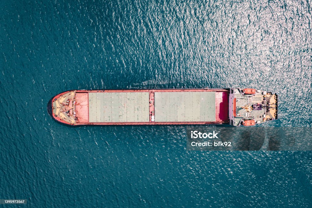 Aerial view of cargo ship in transit. Coal Stock Photo