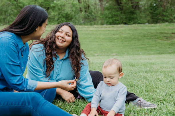 istock Three generation family plays with toddler together at park 1395975549