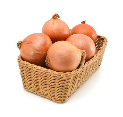 onion fruits in the basket isolated on white background