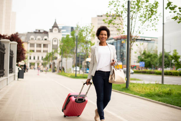 istock Tourist with her luggage 1395978627