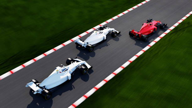 istock red race car leading on a race track 1395990448